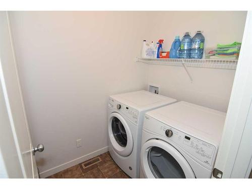 2002-250 Fireside View, Cochrane, AB - Indoor Photo Showing Laundry Room