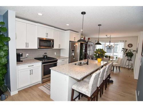 2002-250 Fireside View, Cochrane, AB - Indoor Photo Showing Kitchen With Double Sink With Upgraded Kitchen