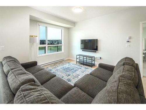 2205-42 Cranbrook Gardens Se, Calgary, AB - Indoor Photo Showing Living Room