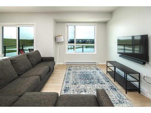 2205-42 Cranbrook Gardens Se, Calgary, AB - Indoor Photo Showing Living Room