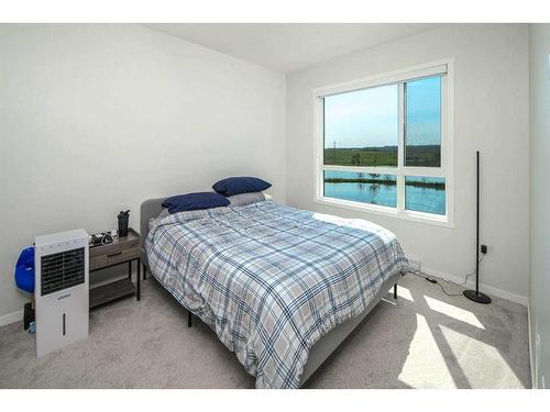 2205-42 Cranbrook Gardens Se, Calgary, AB - Indoor Photo Showing Bedroom