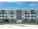 2205-42 Cranbrook Gardens Se, Calgary, AB  - Outdoor With Balcony With Facade 