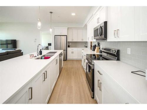 2205-42 Cranbrook Gardens Se, Calgary, AB - Indoor Photo Showing Kitchen With Double Sink With Upgraded Kitchen