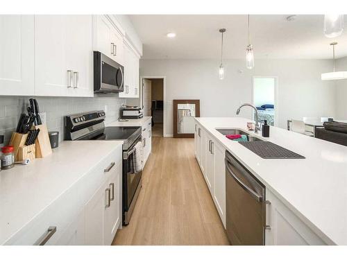 2205-42 Cranbrook Gardens Se, Calgary, AB - Indoor Photo Showing Kitchen With Upgraded Kitchen