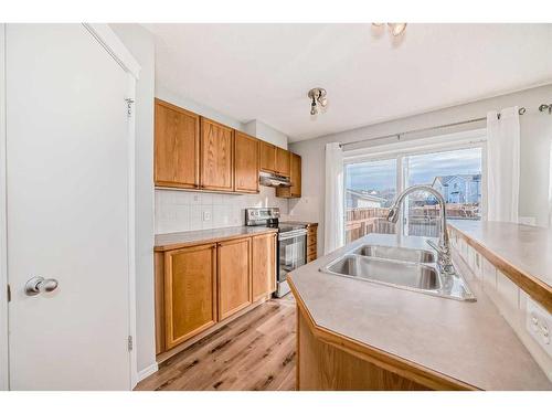 50 Tuscany Springs Heights Nw, Calgary, AB - Indoor Photo Showing Kitchen With Double Sink