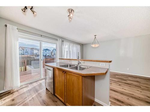 50 Tuscany Springs Heights Nw, Calgary, AB - Indoor Photo Showing Kitchen With Double Sink