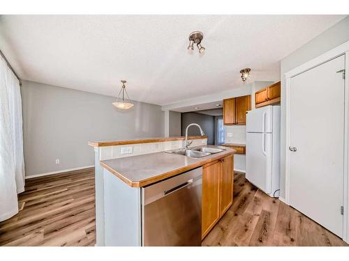 50 Tuscany Springs Heights Nw, Calgary, AB - Indoor Photo Showing Kitchen With Double Sink