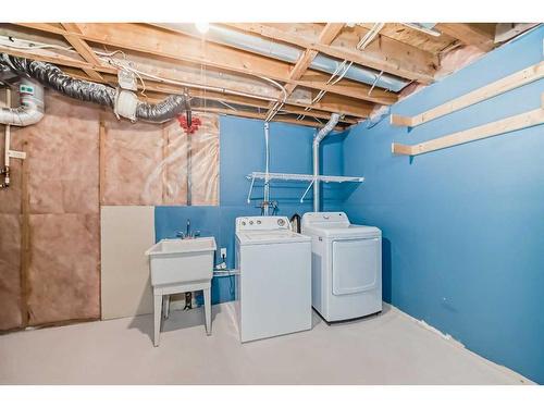 50 Tuscany Springs Heights Nw, Calgary, AB - Indoor Photo Showing Laundry Room