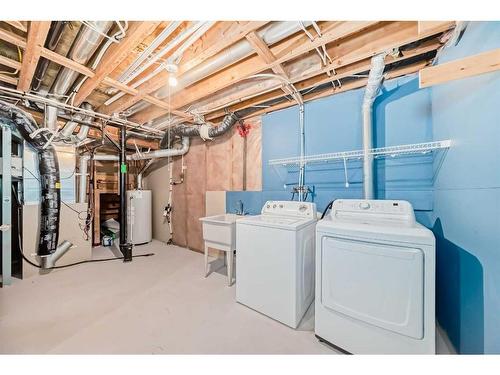 50 Tuscany Springs Heights Nw, Calgary, AB - Indoor Photo Showing Laundry Room