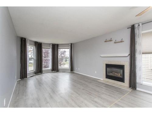 102 Elana Crescent, Lacombe, AB - Indoor Photo Showing Living Room With Fireplace