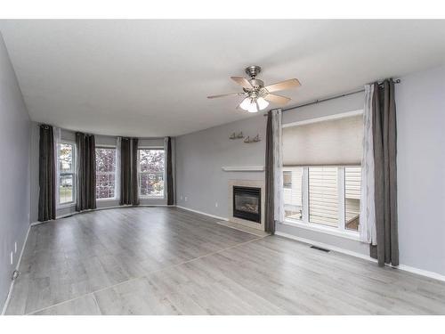 102 Elana Crescent, Lacombe, AB - Indoor Photo Showing Living Room With Fireplace