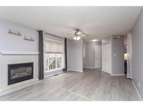 102 Elana Crescent, Lacombe, AB - Indoor Photo Showing Living Room With Fireplace