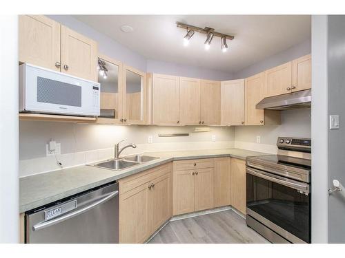 102 Elana Crescent, Lacombe, AB - Indoor Photo Showing Kitchen With Double Sink