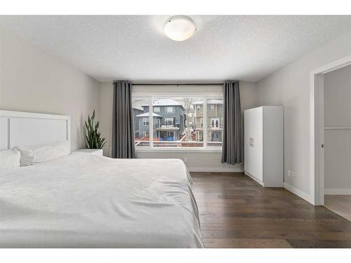 100 Cranbrook Way Se, Calgary, AB - Indoor Photo Showing Bedroom