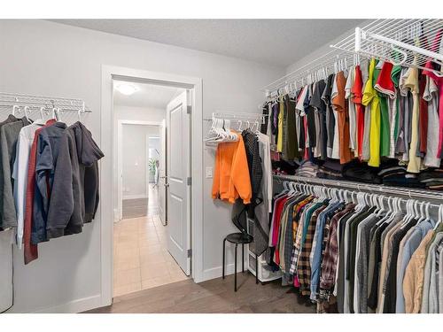 100 Cranbrook Way Se, Calgary, AB - Indoor With Storage