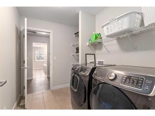 100 Cranbrook Way Se, Calgary, AB - Indoor Photo Showing Laundry Room