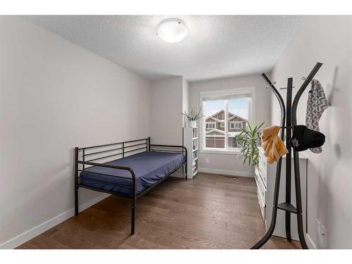 100 Cranbrook Way Se, Calgary, AB - Indoor Photo Showing Bedroom