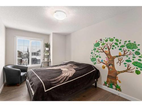 100 Cranbrook Way Se, Calgary, AB - Indoor Photo Showing Bedroom