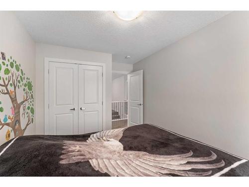 100 Cranbrook Way Se, Calgary, AB - Indoor Photo Showing Bedroom