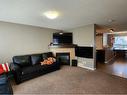 1061 Panatella Boulevard Nw, Calgary, AB  - Indoor Photo Showing Living Room With Fireplace 