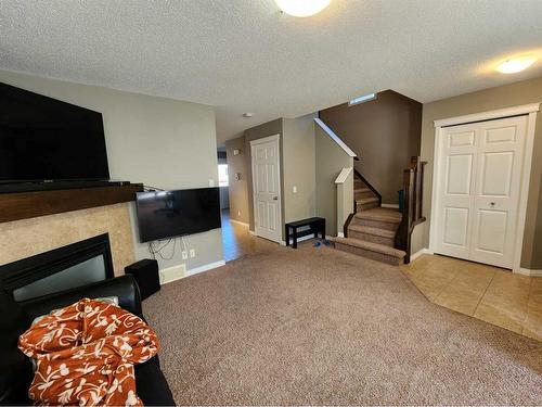 1061 Panatella Boulevard Nw, Calgary, AB - Indoor With Fireplace