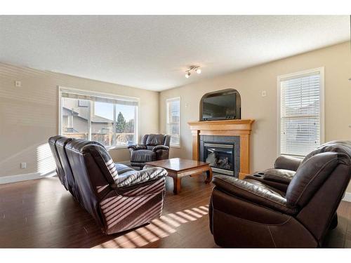 244 Hawkmere View, Chestermere, AB - Indoor Photo Showing Living Room With Fireplace