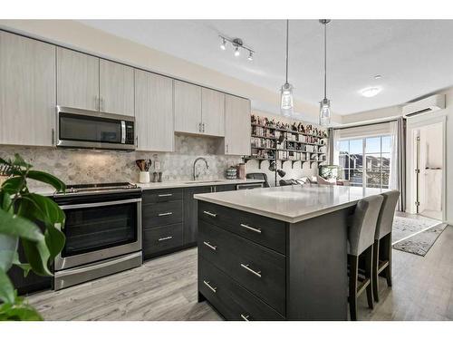 6208-151 Legacy Main Street Se, Calgary, AB - Indoor Photo Showing Kitchen With Upgraded Kitchen