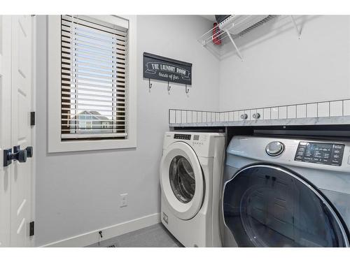 61 Creekstone Square Sw, Calgary, AB - Indoor Photo Showing Laundry Room