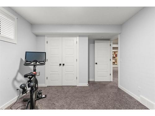 61 Creekstone Square Sw, Calgary, AB - Indoor Photo Showing Gym Room