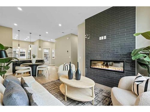 213-595 Mahogany Road Se, Calgary, AB - Indoor Photo Showing Living Room With Fireplace