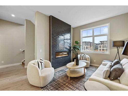 213-595 Mahogany Road Se, Calgary, AB - Indoor Photo Showing Living Room With Fireplace