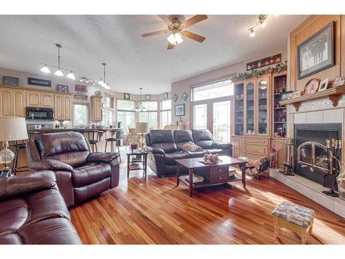 331067 Rge. Rd. 234, Rural Kneehill County, AB - Indoor Photo Showing Living Room With Fireplace