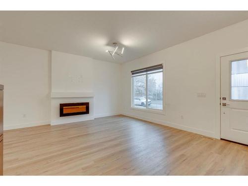 4403 26 Avenue Se, Calgary, AB - Indoor Photo Showing Living Room With Fireplace