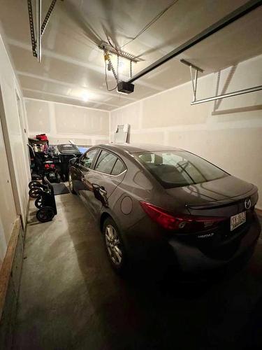 20 Cranbrook Green Se, Calgary, AB - Indoor Photo Showing Garage