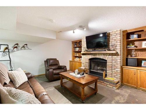 131 Rundlehorn Crescent Ne, Calgary, AB - Indoor Photo Showing Living Room With Fireplace