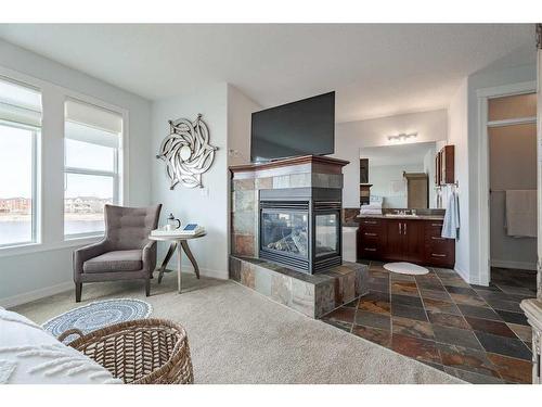 341 Rainbow Falls Way, Chestermere, AB - Indoor Photo Showing Living Room With Fireplace