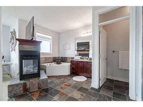 341 Rainbow Falls Way, Chestermere, AB - Indoor With Fireplace