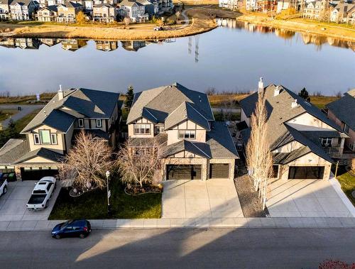 341 Rainbow Falls Way, Chestermere, AB - Outdoor With Body Of Water With Facade