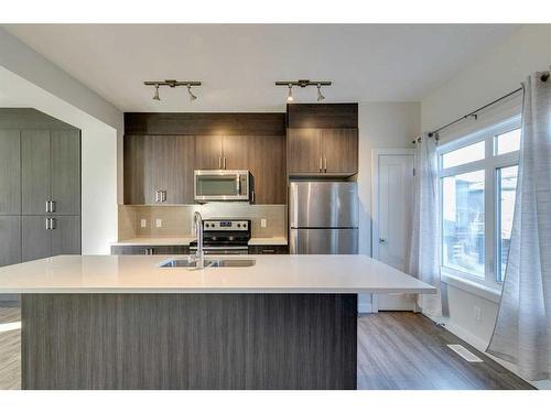 148 Sage Bluff Circle Nw, Calgary, AB - Indoor Photo Showing Kitchen With Stainless Steel Kitchen With Double Sink With Upgraded Kitchen