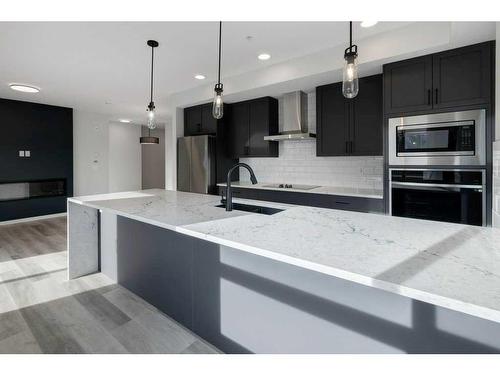 3115-33 Carringham Gate Nw, Calgary, AB - Indoor Photo Showing Kitchen With Stainless Steel Kitchen With Upgraded Kitchen