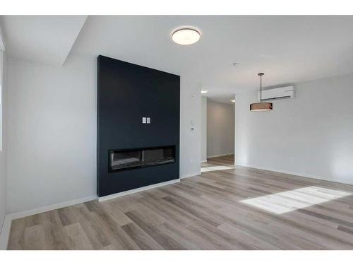 3115-33 Carringham Gate Nw, Calgary, AB - Indoor Photo Showing Living Room With Fireplace