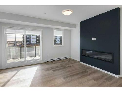 3115-33 Carringham Gate Nw, Calgary, AB - Indoor Photo Showing Living Room With Fireplace