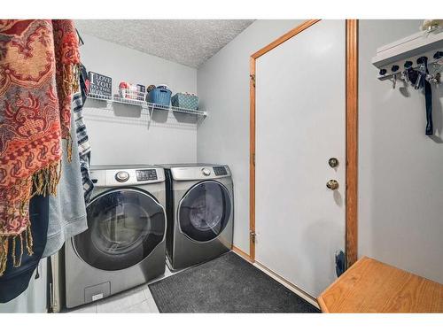 100 Cove Road, Chestermere, AB - Indoor Photo Showing Laundry Room