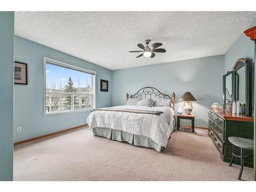 100 Cove Road, Chestermere, AB - Indoor Photo Showing Bedroom