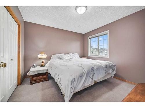 100 Cove Road, Chestermere, AB - Indoor Photo Showing Bedroom