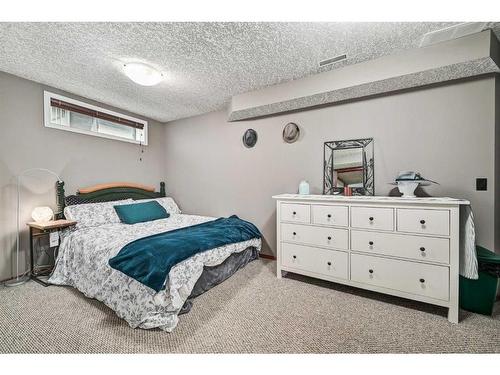 100 Cove Road, Chestermere, AB - Indoor Photo Showing Bedroom