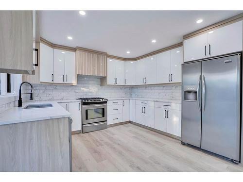 59 Douglas Shore Close Se, Calgary, AB - Indoor Photo Showing Kitchen With Upgraded Kitchen