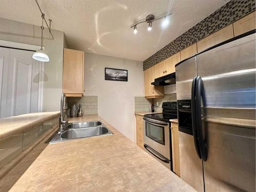 4115-60 Panatella Street Nw, Calgary, AB - Indoor Photo Showing Kitchen With Double Sink