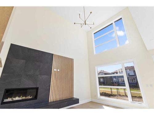 193 South Shore View, Chestermere, AB - Indoor Photo Showing Other Room With Fireplace