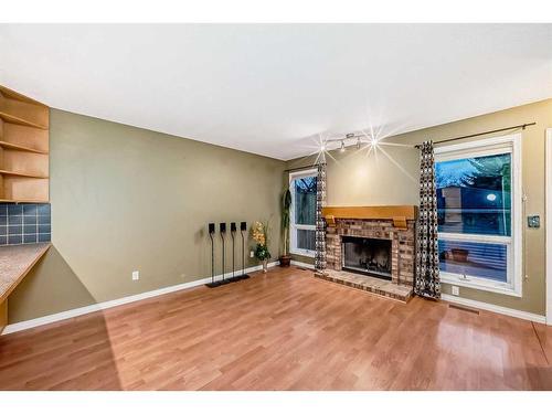 219 Coachway Road Sw, Calgary, AB - Indoor Photo Showing Other Room With Fireplace